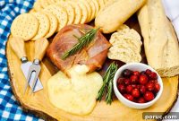 Prosciutto-Wrapped Brie: Baked Appetizer with Honey & Herbs