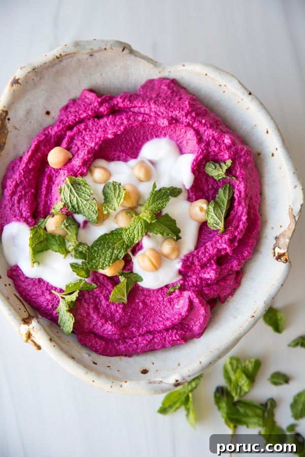 Roasted Beet Hummus Recipe — Vibrant Vegan Dip for Parties 2 beet hummus in a bowl