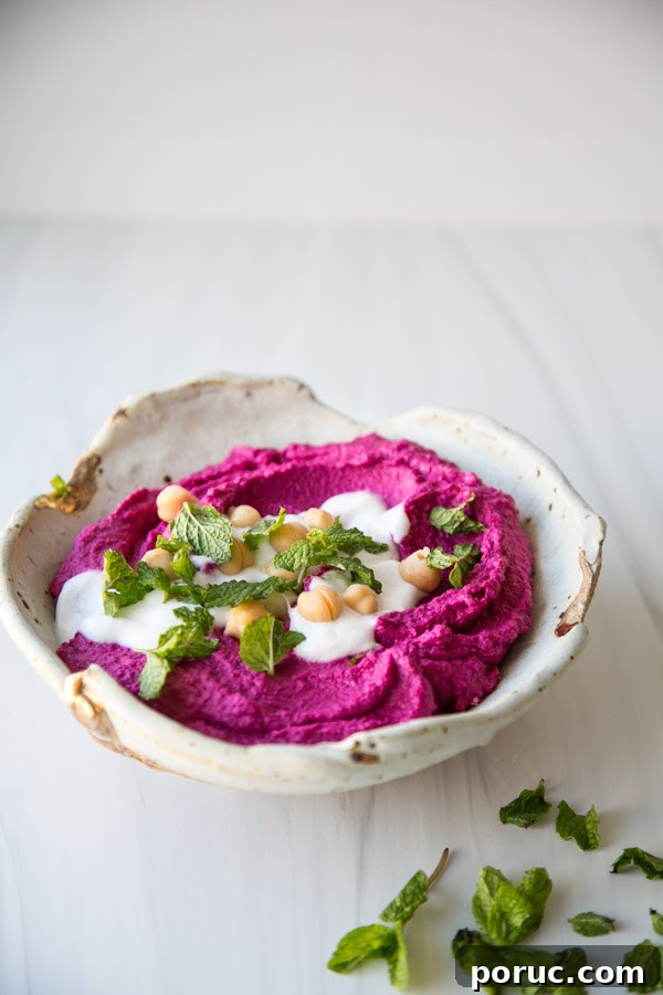 Roasted Beet Hummus Recipe — Vibrant Vegan Dip for Parties 5 beet hummus in a bowl