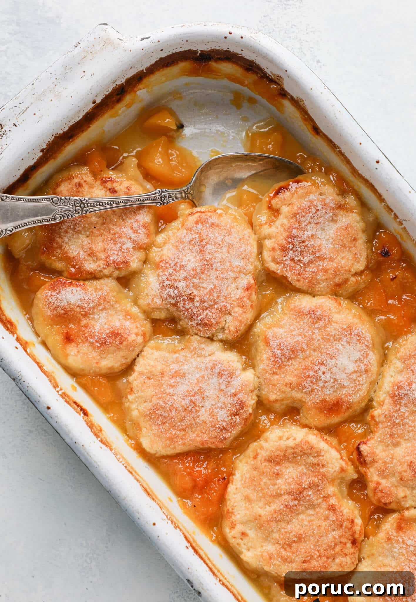 Old Fashioned Peach Cobbler baked in vintage dish