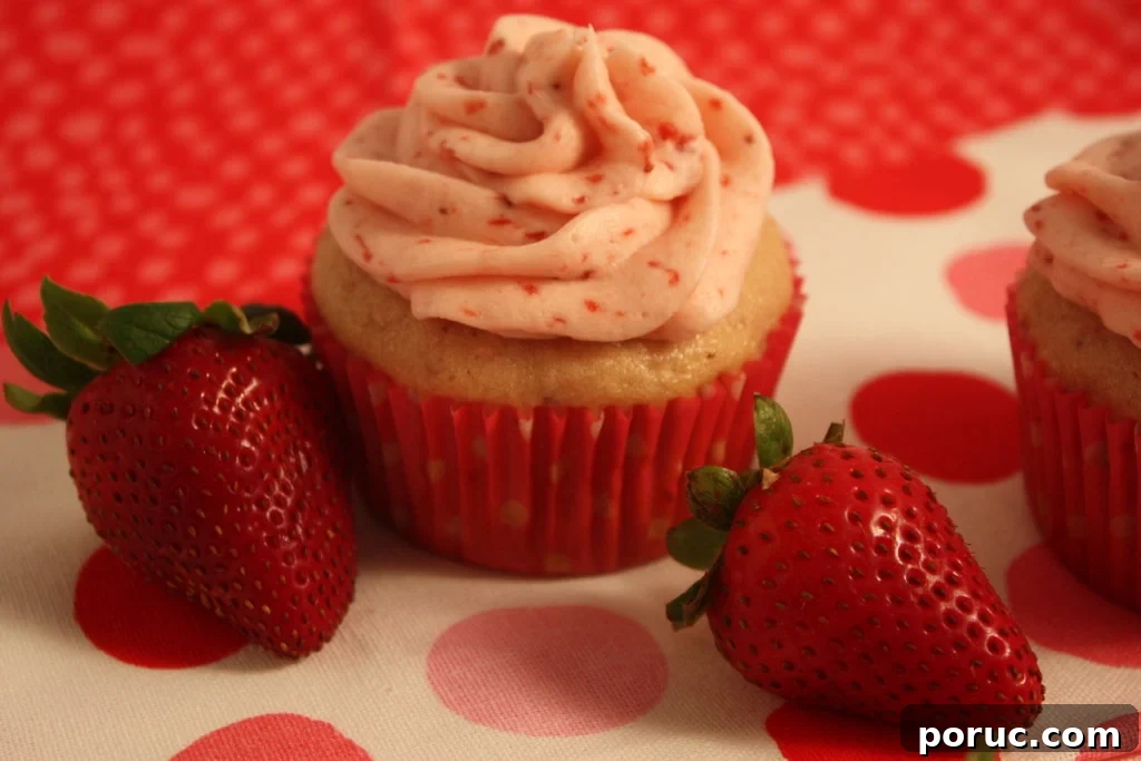 Fresh Strawberry Cupcakes on a red polka dot tablecloth.