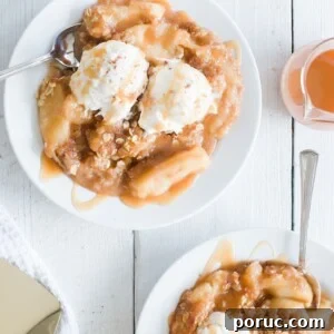 Dutch Apple Baby Recipe: Puffy Baked Apple Pancake with Cinnamon 7 Three plates with apple crisp topped with vanilla ice cream and caramel sauce. A glass of apple juice is beside one plate, and theres a metallic spatula and striped cloth nearby on the white wooden table.