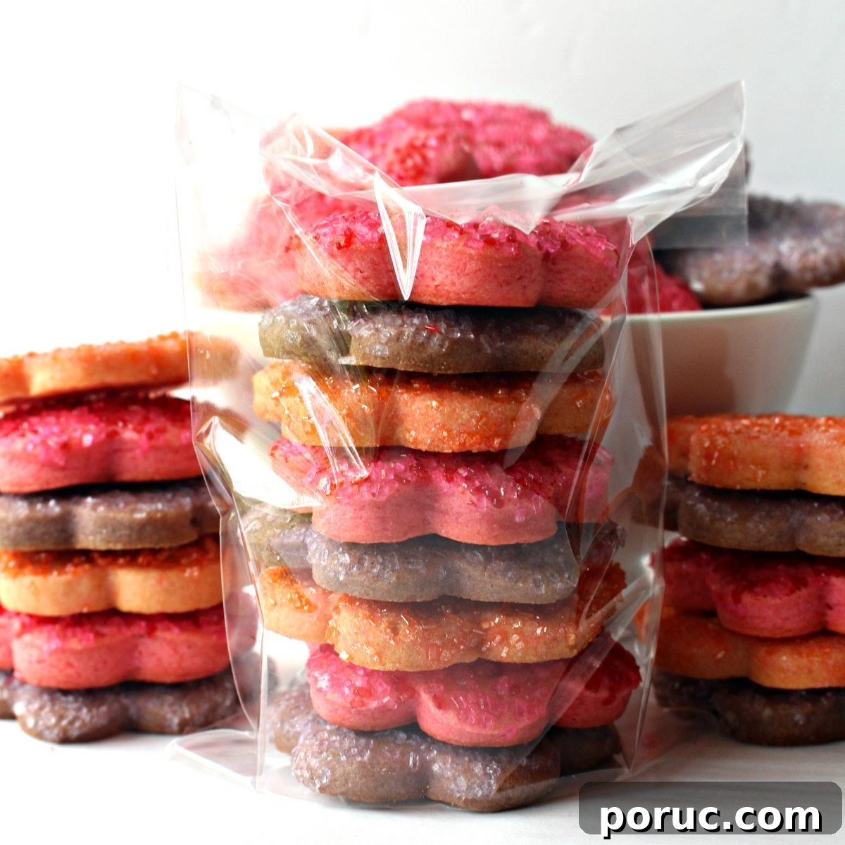 Jam-Filled Butter Cookies Recipe: Crispy, Buttery Thumbprints 5 Cookies stacked inside a cellophane gift bag.