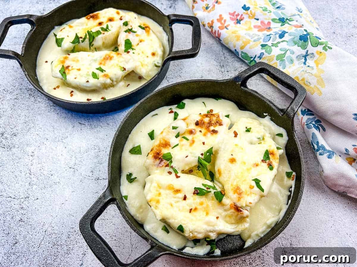 25 Comfort-Food Recipes That Satisfy Every Craving 19 Giant Cheese Stuffed Pasta Shells in two black serving dishes.