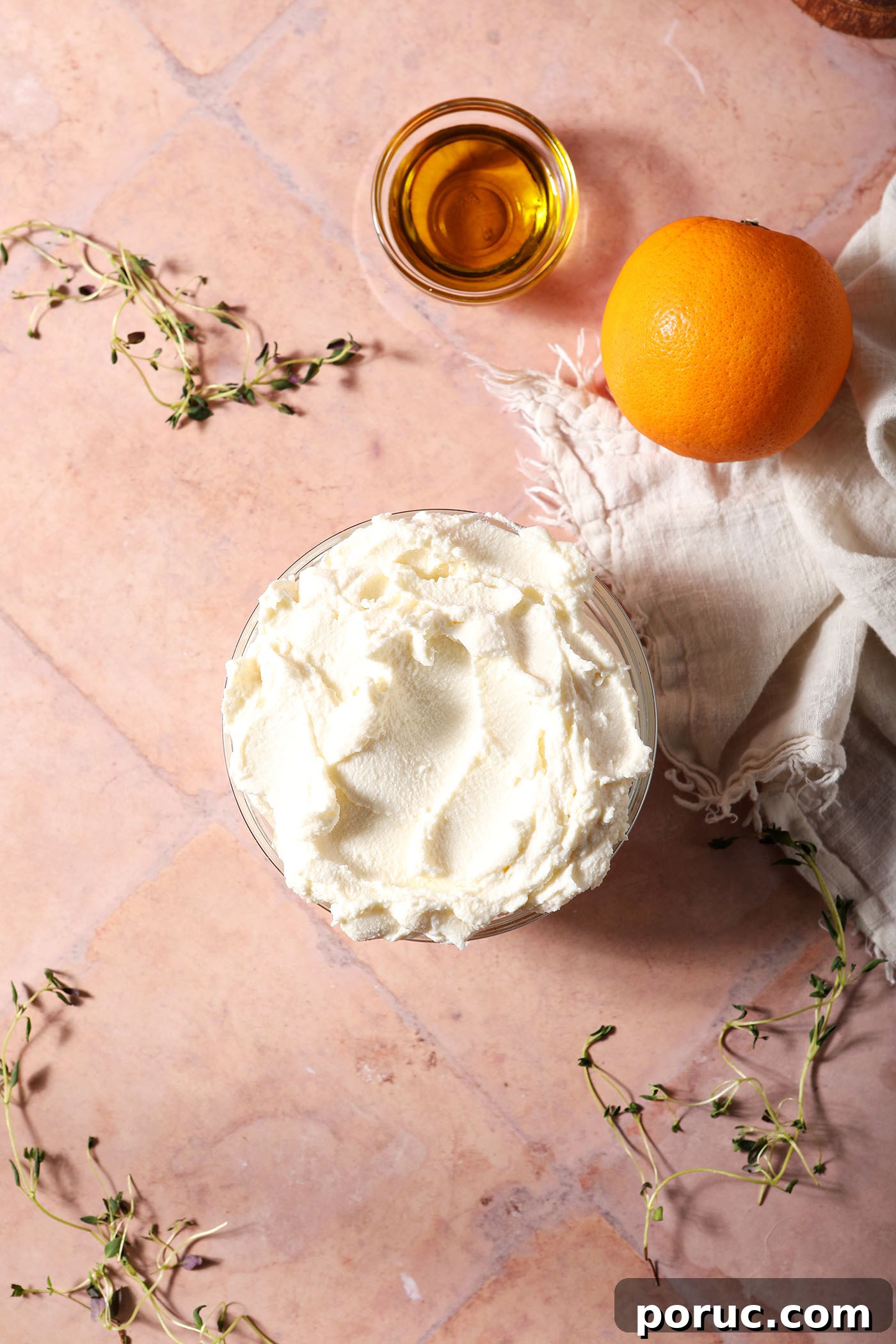 Creamy Whipped Ricotta Dip with Lemon and Herbs 3 Ingredients to make whipped ricotta on a terracotta surface surrounded by fresh thyme sprigs