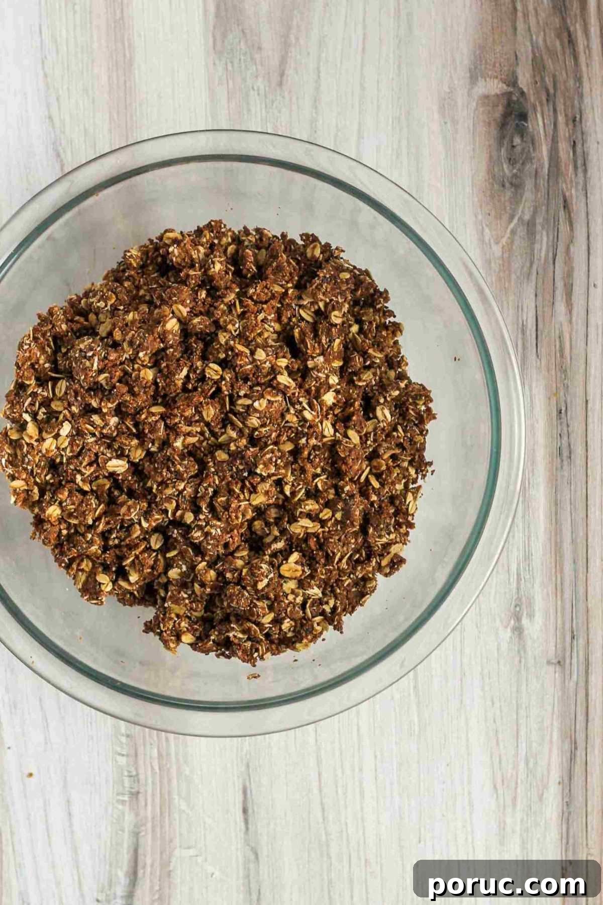 Chocolate Coconut Peanut Butter Energy Bites for Snacks 6 Oat, peanut butter, and chocolate mixture in a glass mixing bowl.