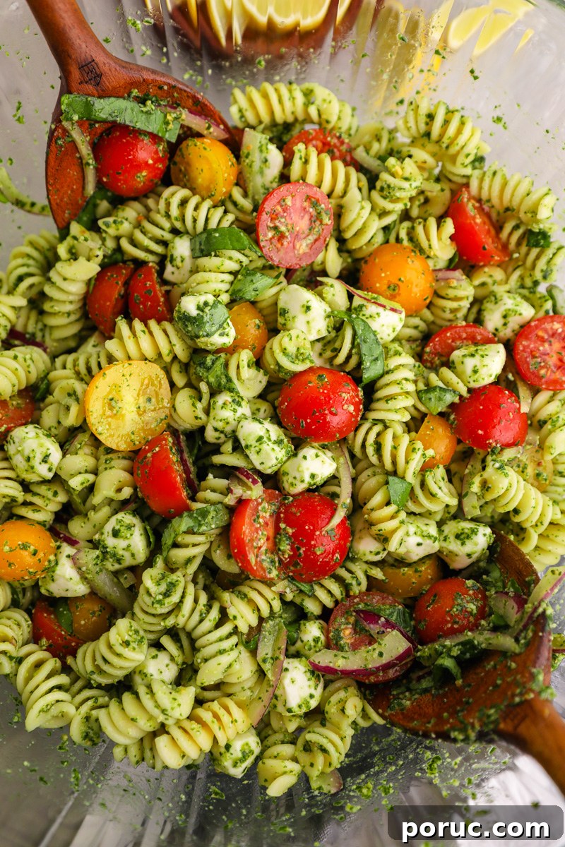 Kale Pesto Recipe: Flavorful Homemade Sauce for Pasta & Sandwiches 3 A large clean mixing bowl filled with pesto pasta salad made with kale pesto.