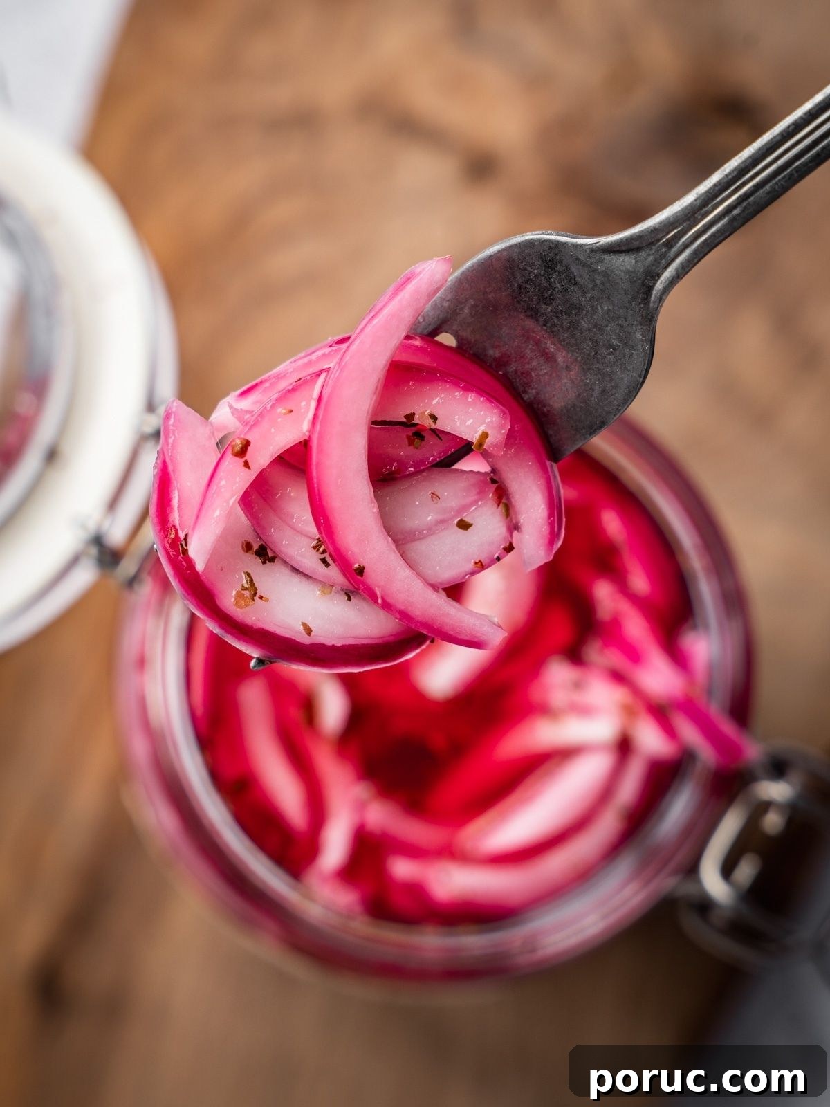 Yucatan-Style Mexican Pickled Red Onions for Tacos & Salads 13 A fork showing the finished pickled onions.