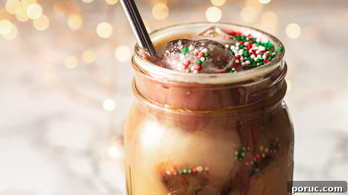 Iced Sugar Cookie Almond Milk Latte — Starbucks Copycat Recipe 5 closeup of christmas cookie latte with lights in the background