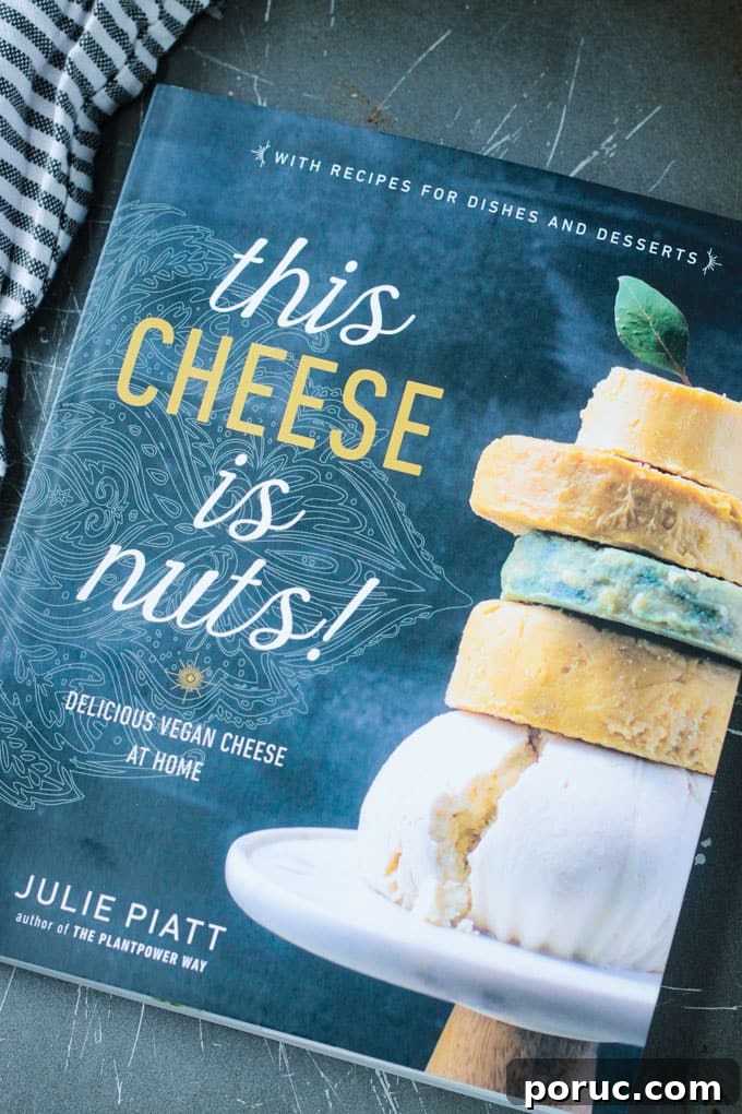 Smoked Almond Cheddar Spread - a delicious and super easy vegan cheddar cheese spread. Only 5 ingredients and made all in the food processor. Spread it on crackers, use it as a sandwich spread, dip fresh fruits and veggies in it - you're gonna love this smoky spread! This Cheese is Nuts book cover.