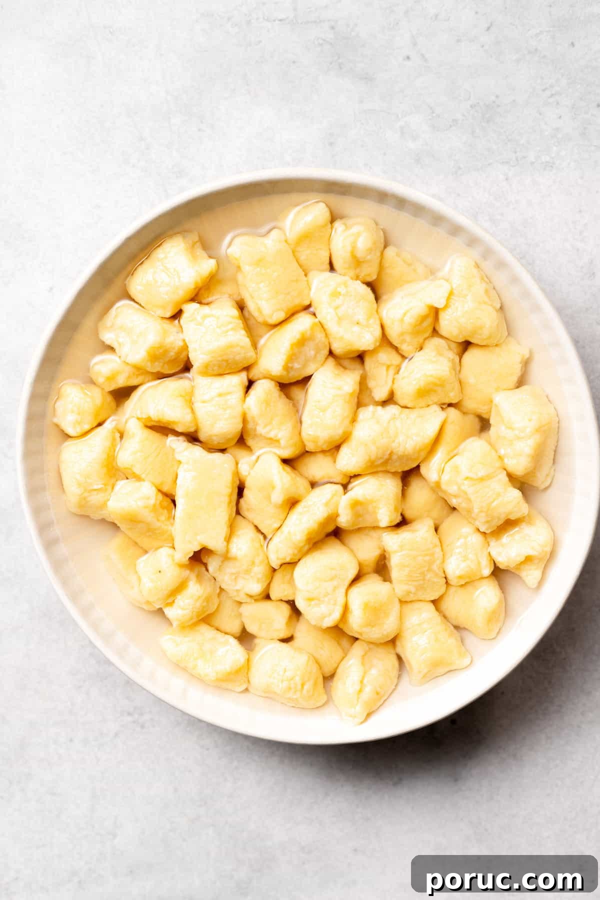 This Homemade Ricotta Gnocchi is as simple as it is delicious. All you need is 5 simple ingredients for this amazing gnocchi recipe. Enjoy! ricotta gnocchi in a bowl.