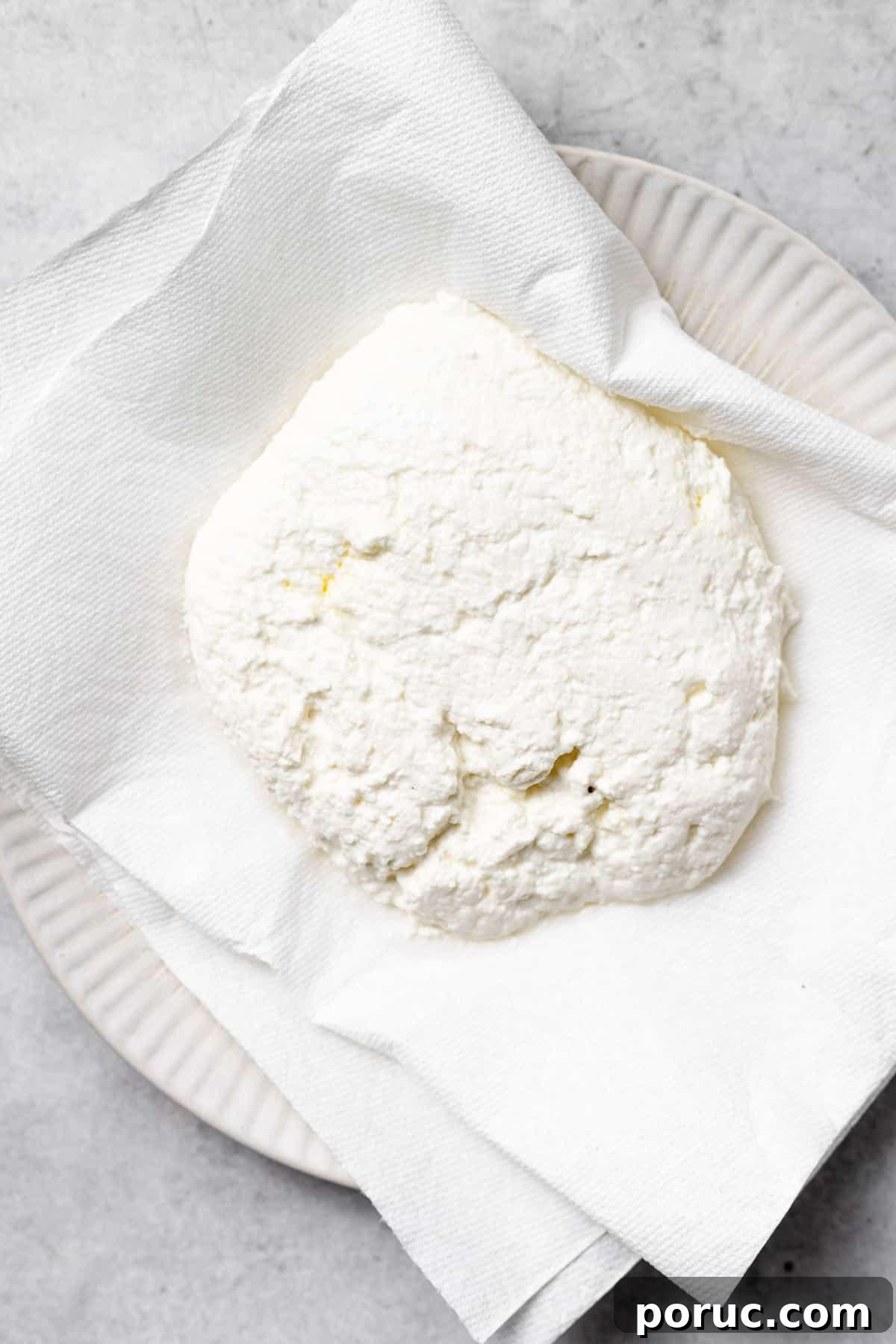 Removing moisture from ricotta for gnocchi removing the moisture from ricotta cheese to be used in ricotta gnocchi.