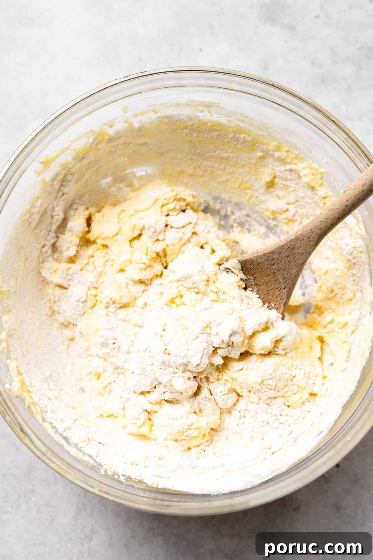 Mixing ricotta gnocchi dough ricotta gnocchi dough being mixed together in a bowl.