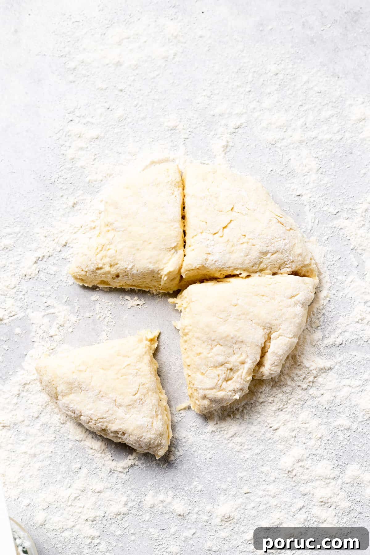 Dividing gnocchi dough into quarters ricotta gnocchi dough split into fourths.