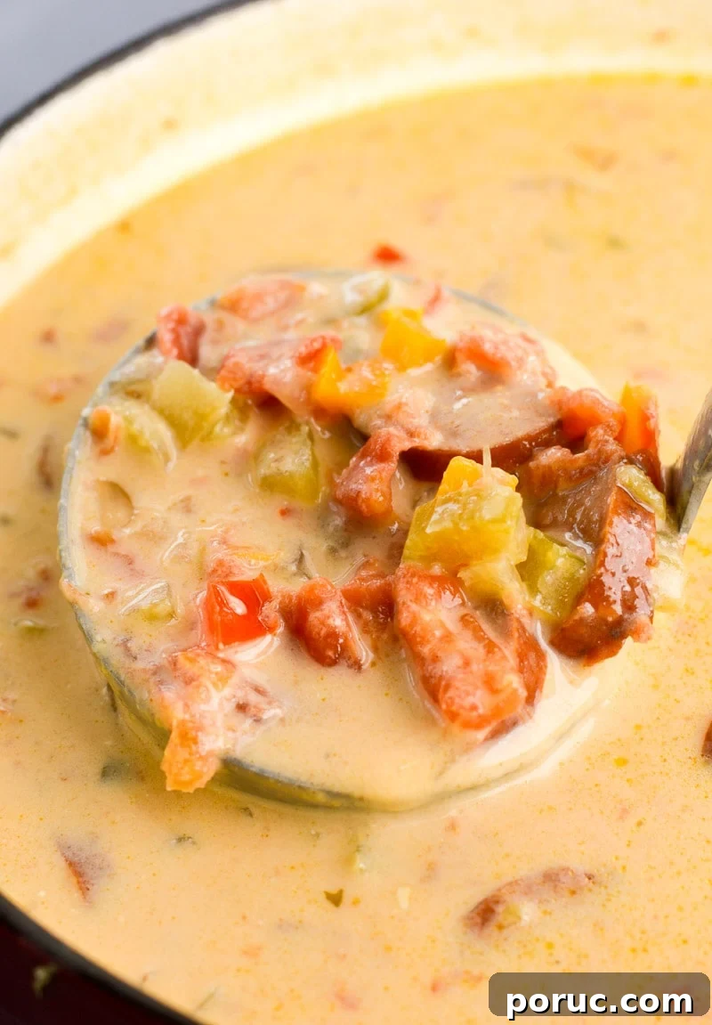 This Cheesy Smoked Sausage Soup is loaded with spicy sausage, tender vegetables in a creamy, cheesy sauce! At less than 7 net carbs per serving this is a great low carb, keto-friendly soup!