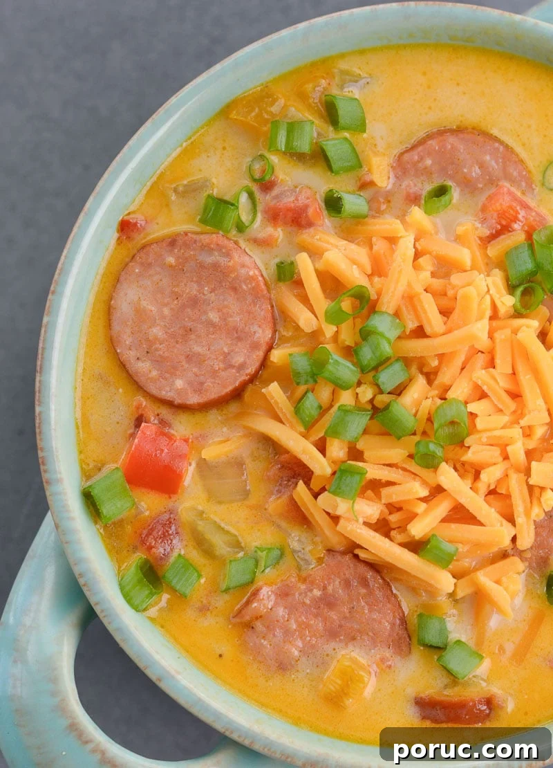This Cheesy Smoked Sausage Soup is loaded with spicy sausage, tender vegetables in a creamy, cheesy sauce! At less than 7 net carbs per serving this is a great low carb, keto-friendly soup!