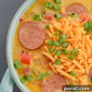 This Cheesy Smoked Sausage Soup is loaded with spicy sausage, tender vegetables in a creamy, cheesy sauce! At less than 7 net carbs per serving this is a great low carb, keto-friendly soup!
