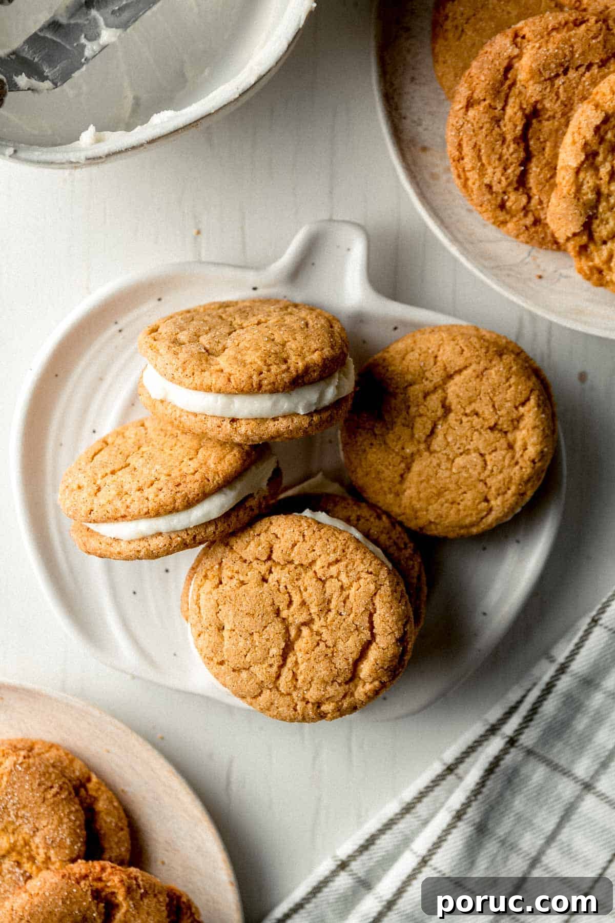 Gluten-Free Pumpkin Cream Pie Recipe for Fall Gatherings 5 Gluten-free pumpkin sandwich cookies on a small pumpkin shaped plate.