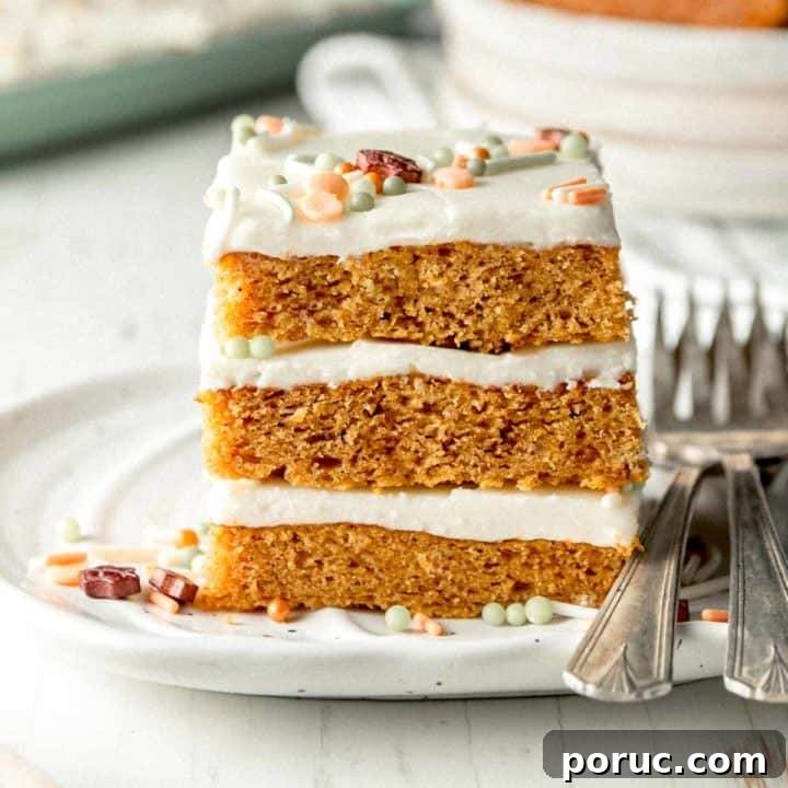 A stack of three gluten-free pumpkin bars topped with sprinkles on a small pumpkin plate.