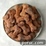 Plate of bone shaped sweet potato dog treats.