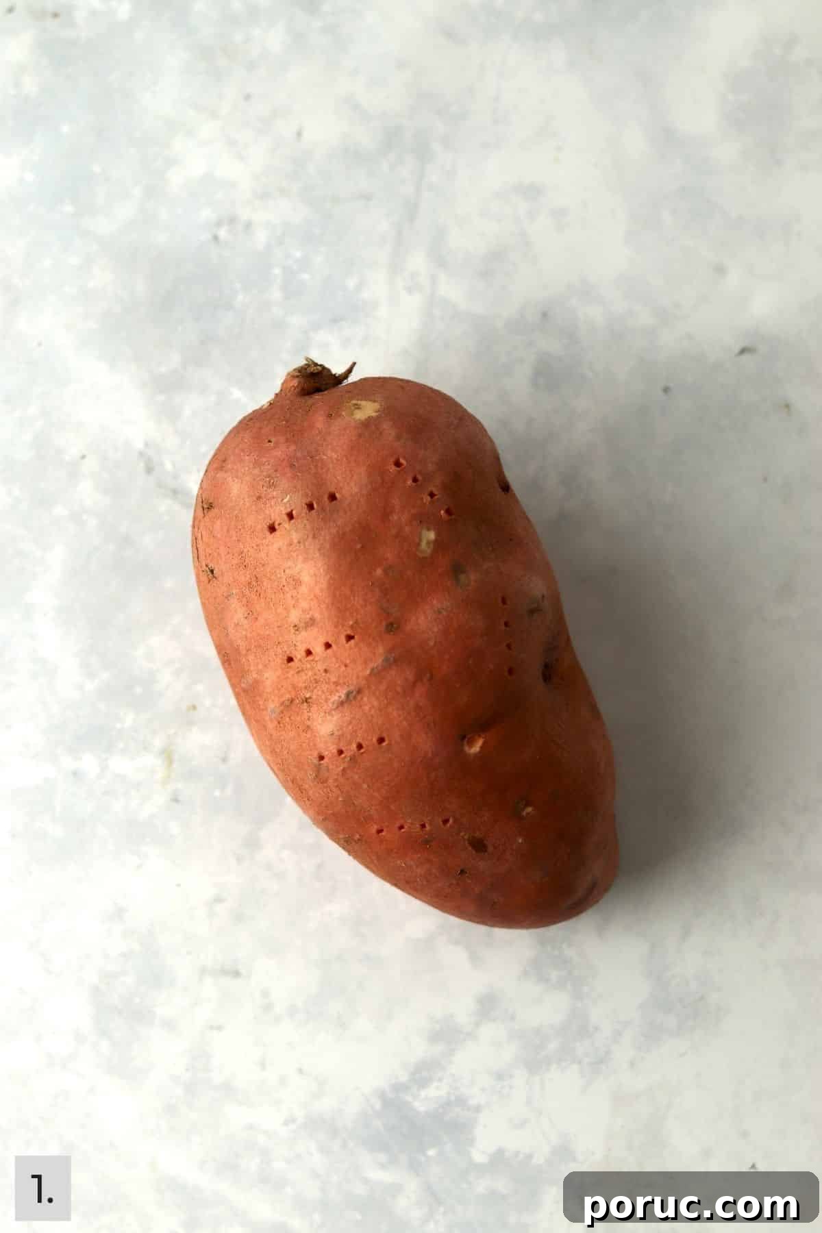 Baked Sweet Potato Dog Treats You Can Make at Home 4 Sweet potato pierced with a fork.