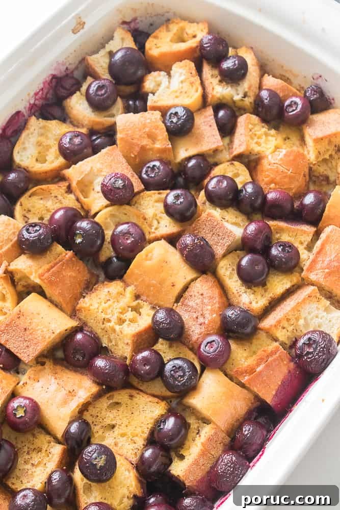 Blueberry French Toast Casserole Recipe for Brunch or Holidays 4 blueberries on top of the French bred in casserole dish