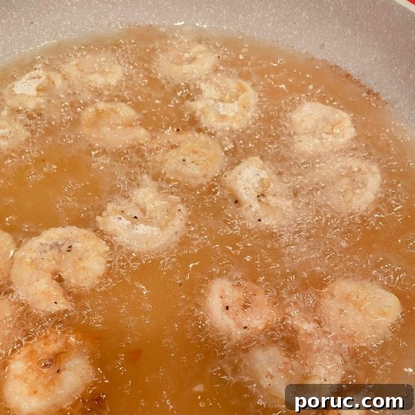 Crispy Shrimp Po' Boy Sandwich Recipe for Classic New Orleans Flavor 8 shrimp frying in oil