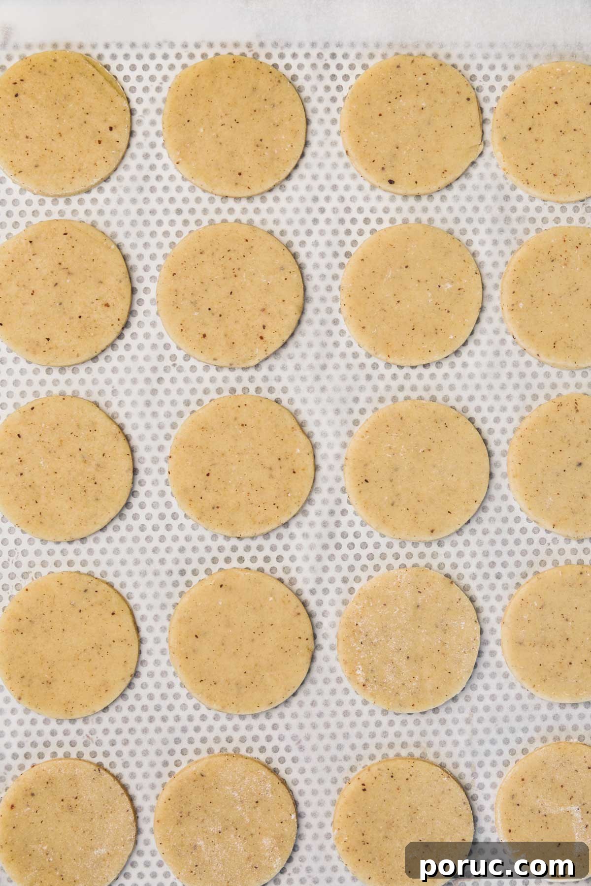 bakind sheet with cut-outs cookies