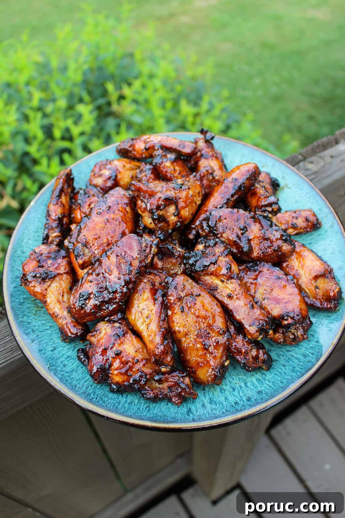 Crispy Baked Peach-Glazed Chicken Wings 2 Maple Peach Sticky Wings on a serving platter