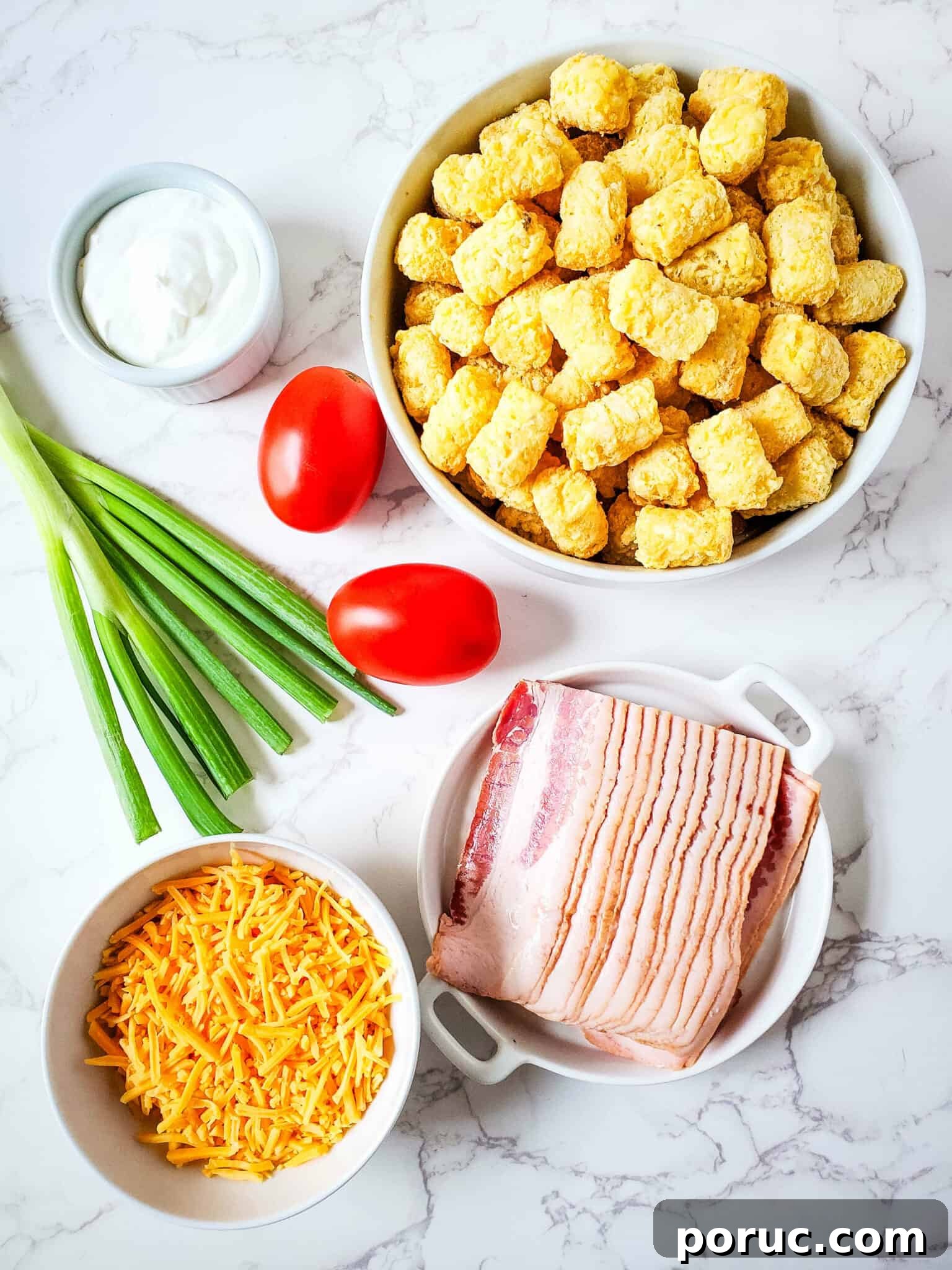 Cheesy Bacon Loaded Tater Tots Recipe 4 Bacon, onions, potatoes, tomatoes and cheese.