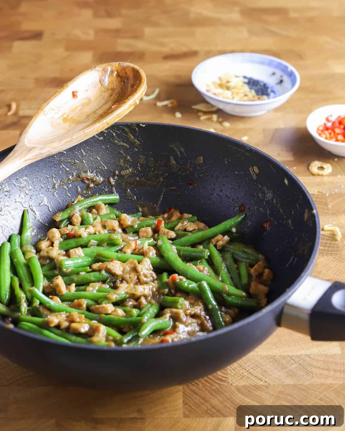 Chinese-Style Green Beans with Crispy Tempeh (Vegan Recipe) 2 photo of a pan of vegan chinese green beans and tempeh