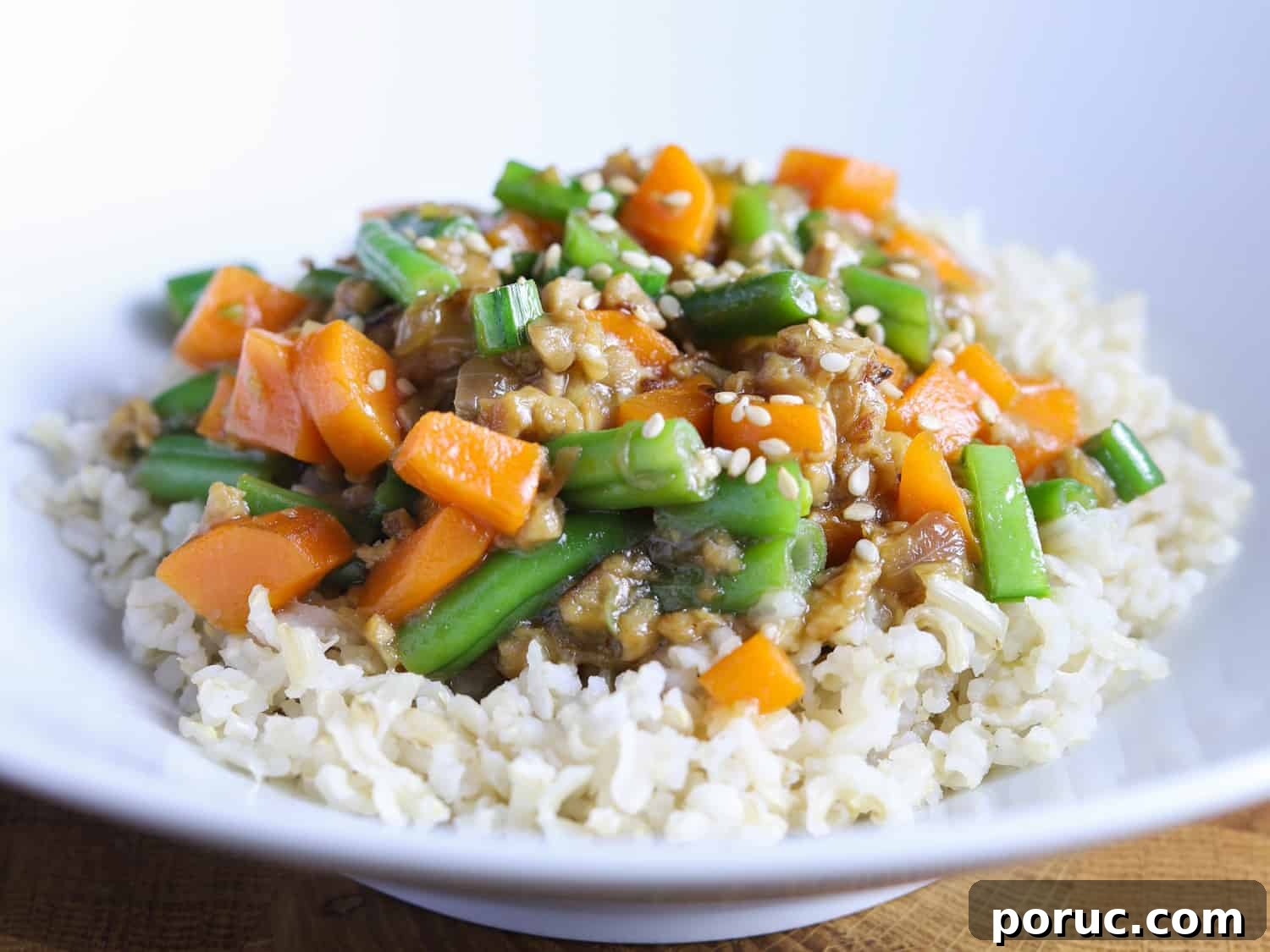 Chinese-Style Green Beans with Crispy Tempeh (Vegan Recipe) 6 photo of a bowl of vegan chinese green beans and tempeh adapted for children (with carrot)