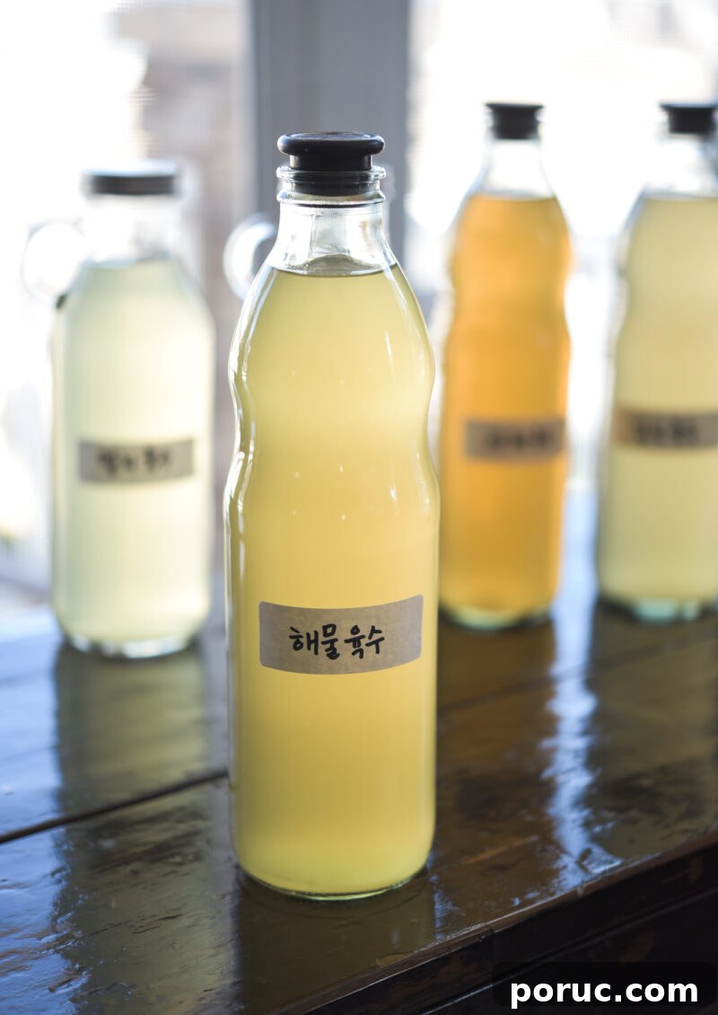 5 Essential Korean Soup Stocks for Authentic Korean Cooking 10 Seafood stock is in a glass bottle with a Korean label attached.