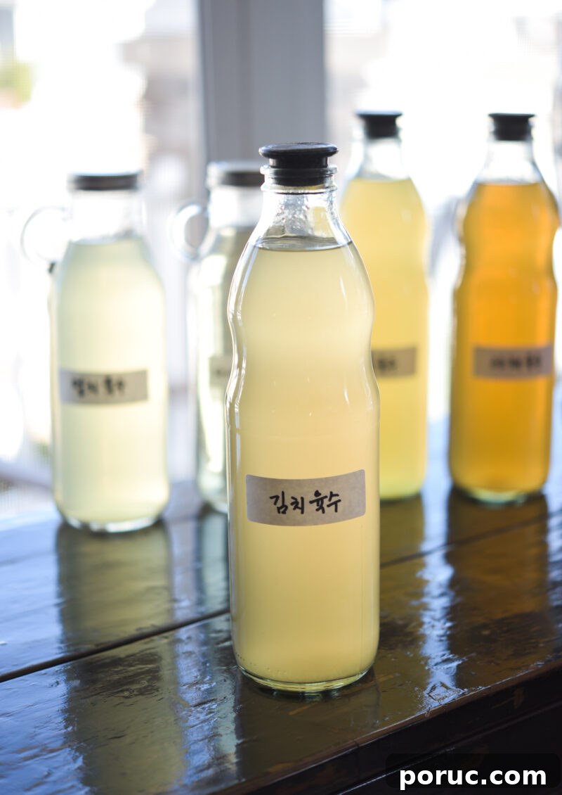 5 Essential Korean Soup Stocks for Authentic Korean Cooking 16 Stock for making kimchi is stored in a glass bottle with a Korean label attached.
