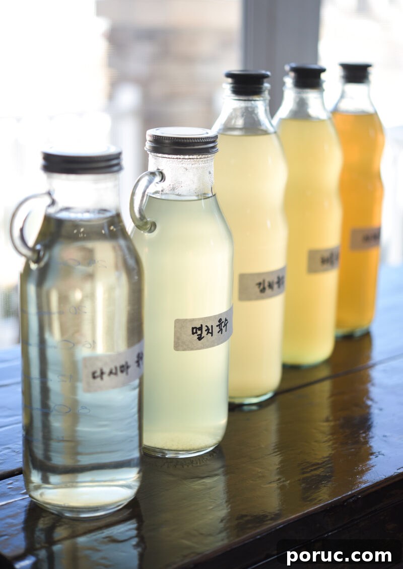 5 Essential Korean Soup Stocks for Authentic Korean Cooking 3 Different types of Korean soup stocks with label are displayed on the table.