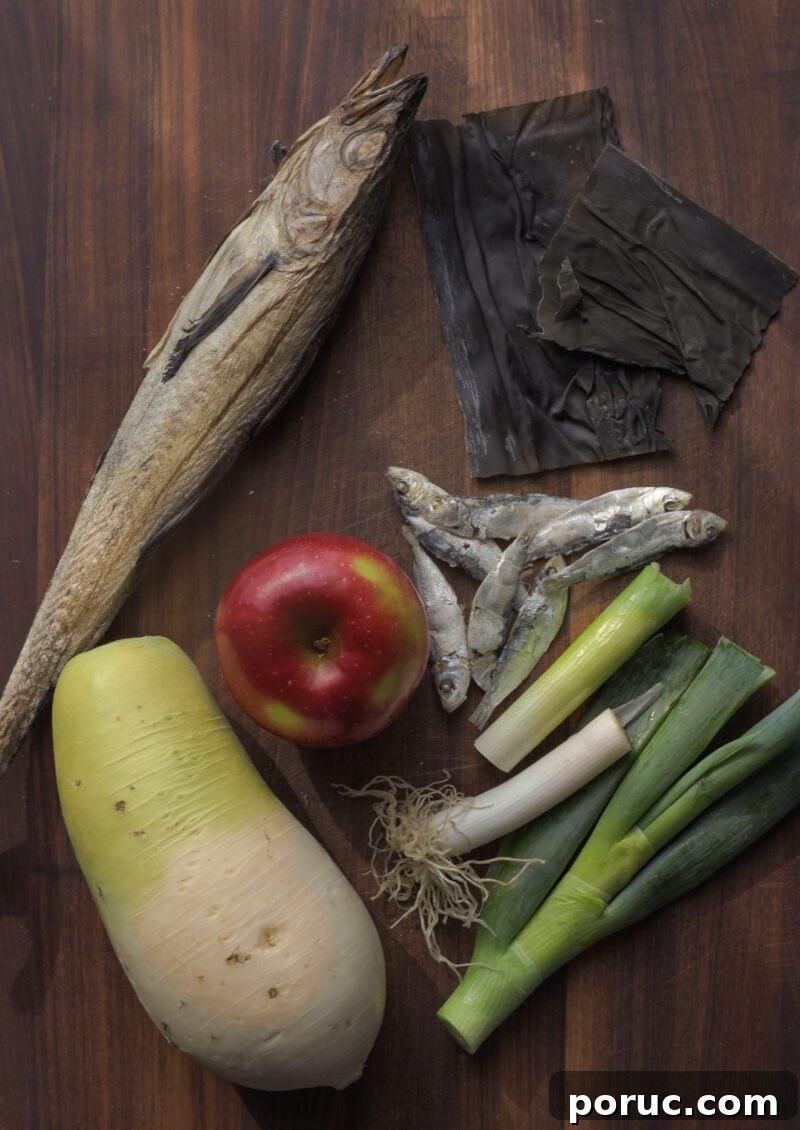 5 Essential Korean Soup Stocks for Authentic Korean Cooking 17 Dried whole fish, other dried seafood, apple and radish are gathered and displayed.