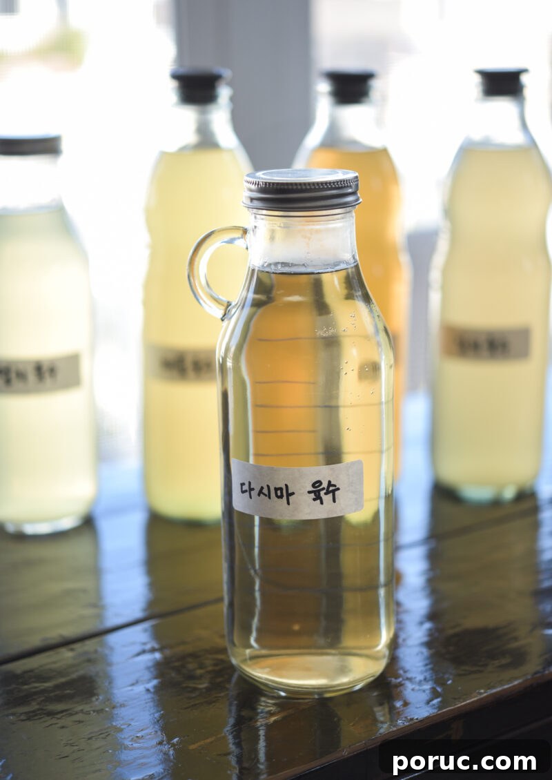 5 Essential Korean Soup Stocks for Authentic Korean Cooking 4 Homemade Korean sea kelp stock is stored in a glass jar with a Korean label attached.