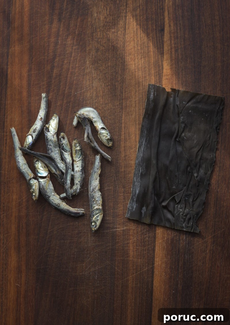 5 Essential Korean Soup Stocks for Authentic Korean Cooking 8 Dried anchovies and dried sea kelp are displaying on the wooden board.