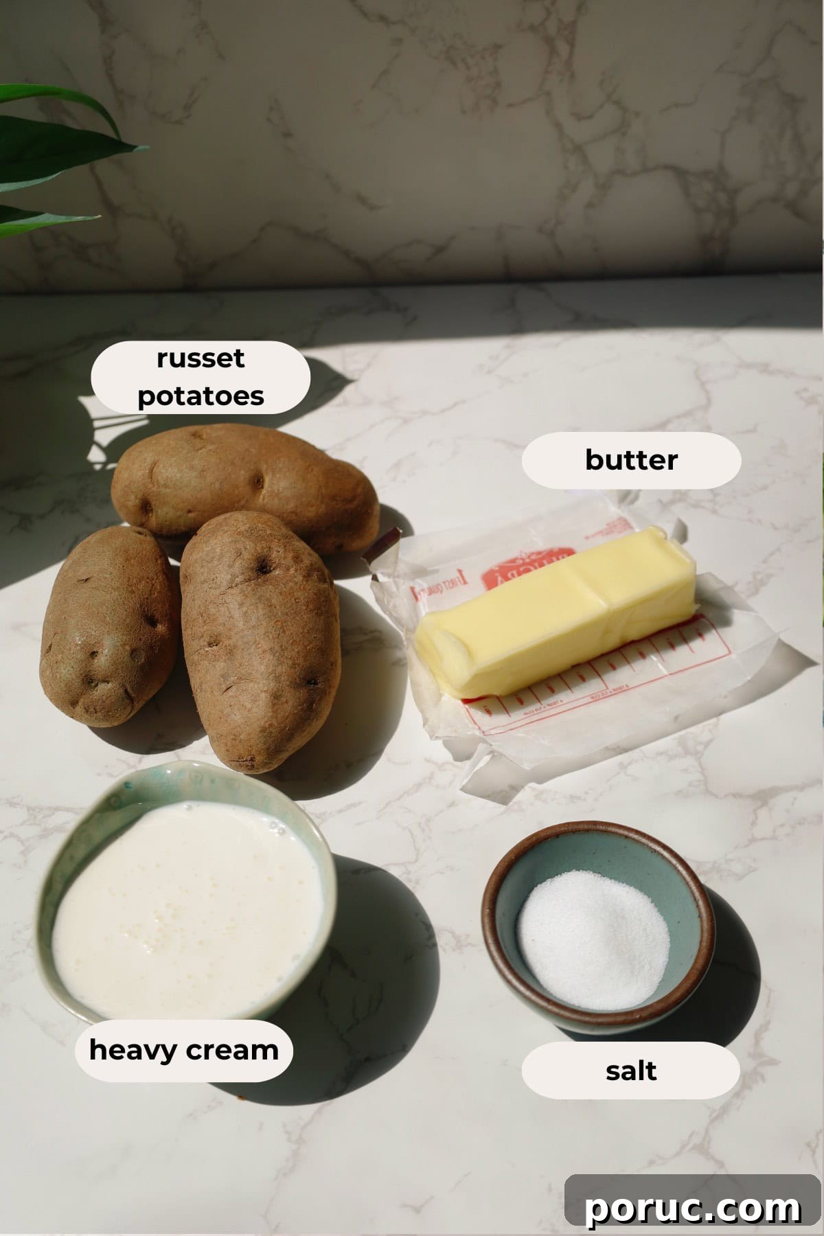 Ingredients for the recipe: russet potatoes, butter, heavy cream, and salt.