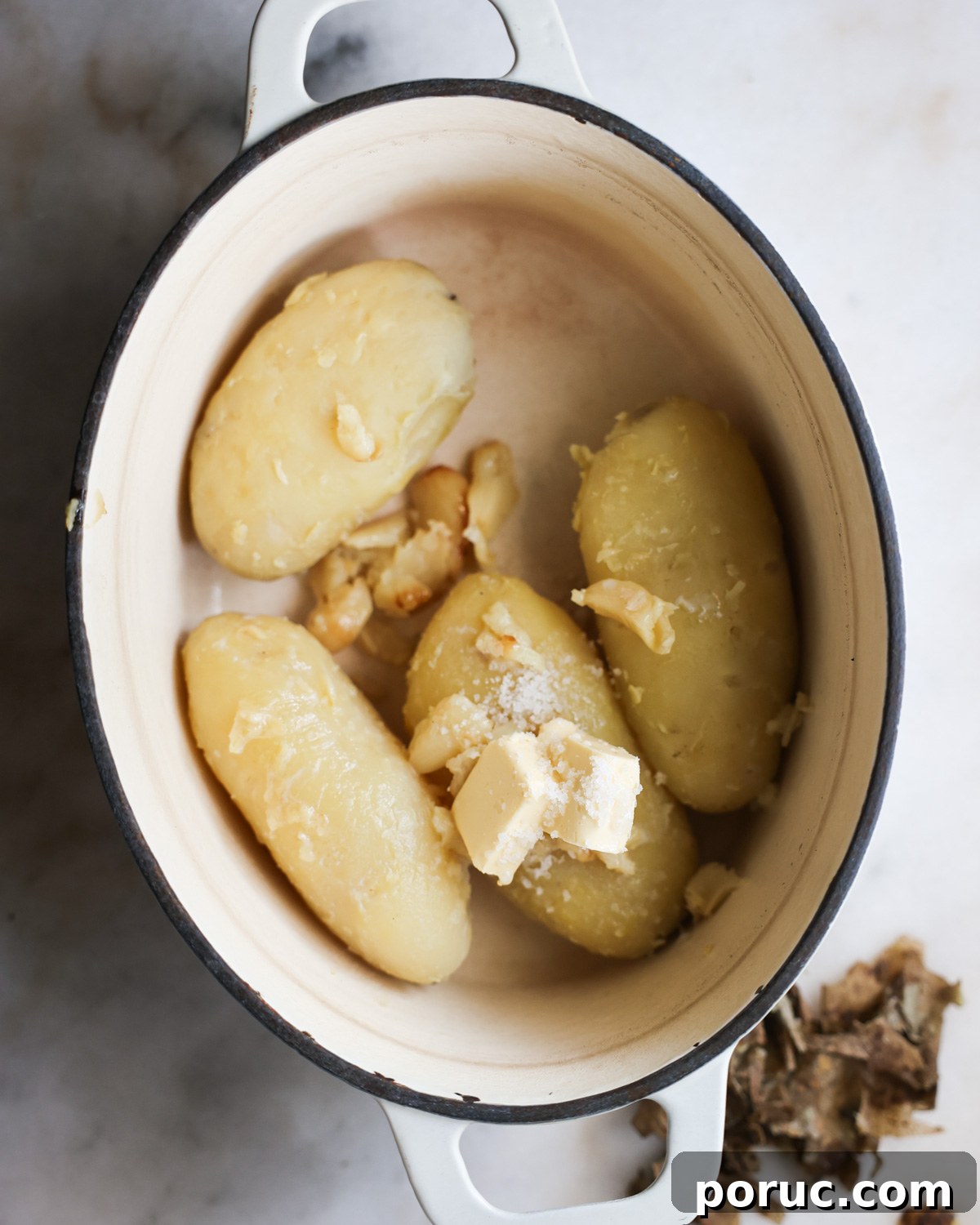 Fluffy Vegan Mashed Potatoes Recipe for Creamy Comfort 9 overhead of russet potatoes and other ingredients in a pot