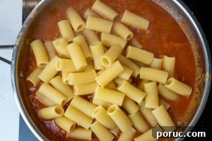 Creamy Tomato Pasta Without Dairy: Rich Vegan Tomato Pasta Recipe 15 Adding in the pasta