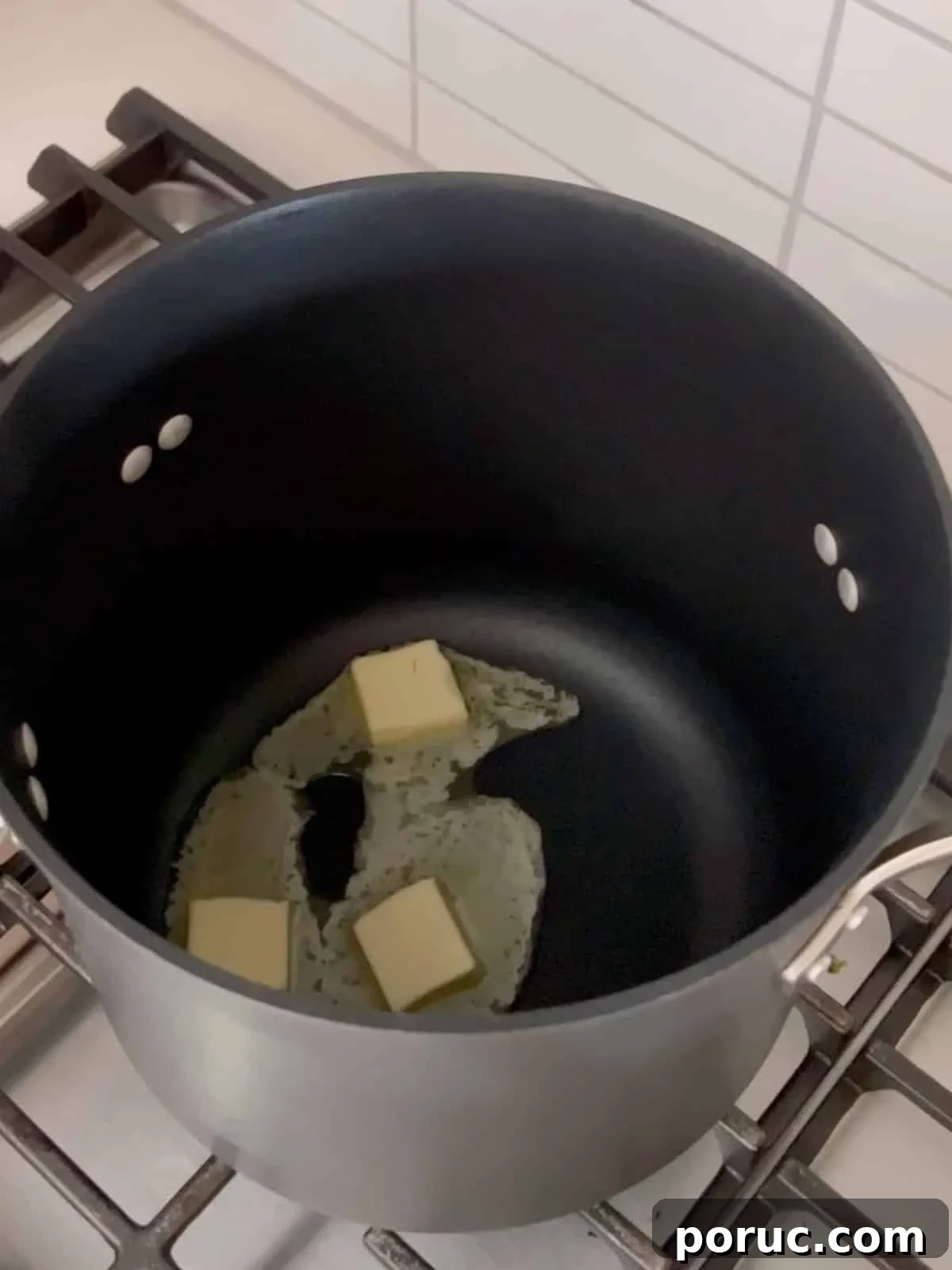Homemade Cinnamon Toast Crunch Treat Bars Recipe 5 Butter melting in a large pot.