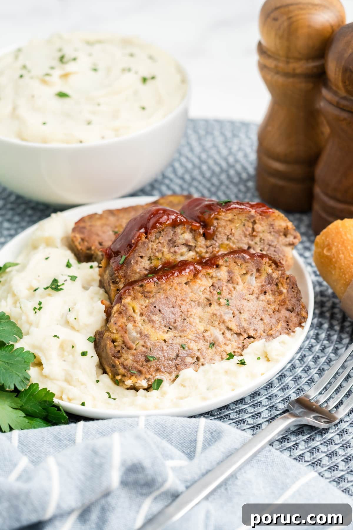 1-Pound Classic Meatloaf Recipe for Moist, Flavorful Results 2 Meatloaf on a plate sliced up.
