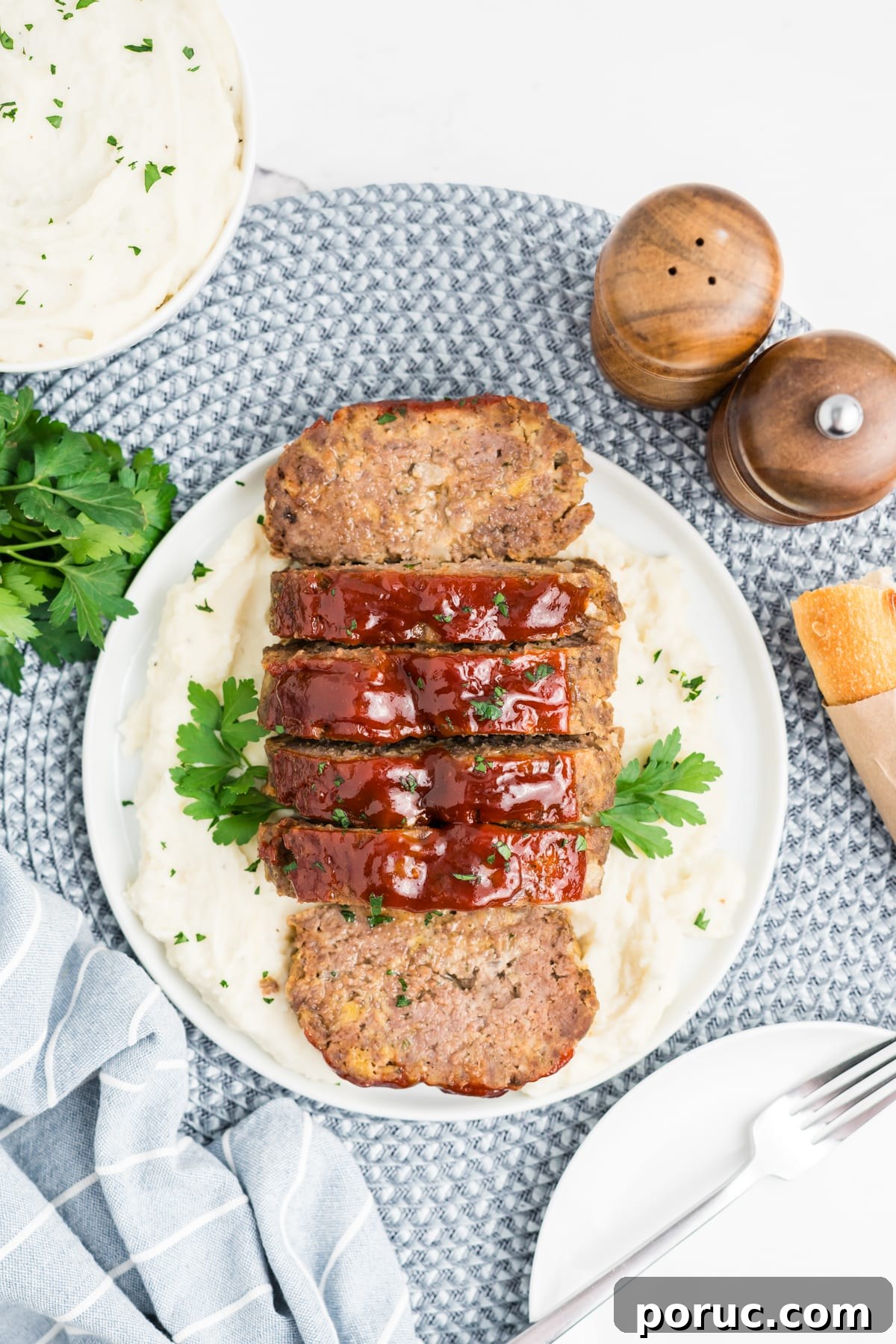 1-Pound Classic Meatloaf Recipe for Moist, Flavorful Results 12 Sliced up meatloaf on a plate.