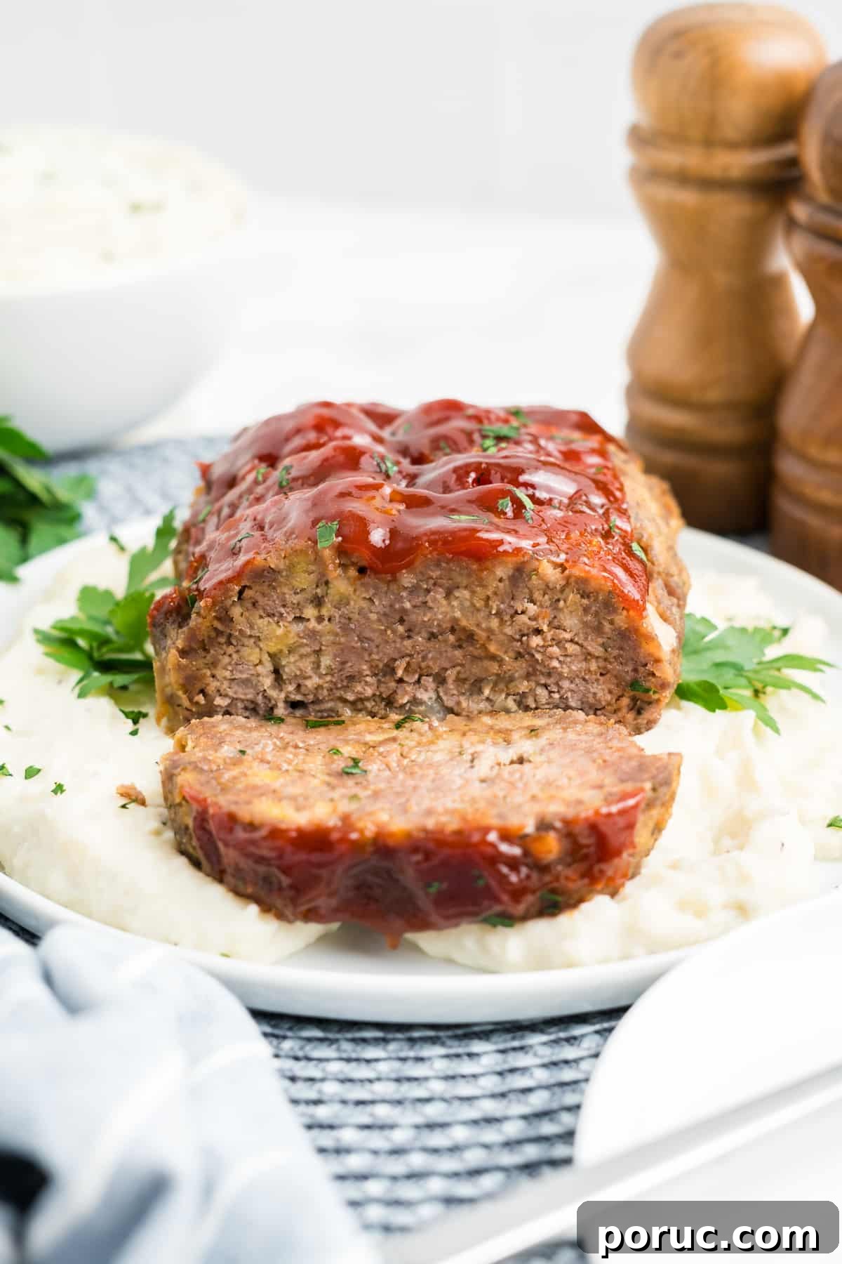 1-Pound Classic Meatloaf Recipe for Moist, Flavorful Results 13 1 pound meatloaf recipe over mashed potatoes.
