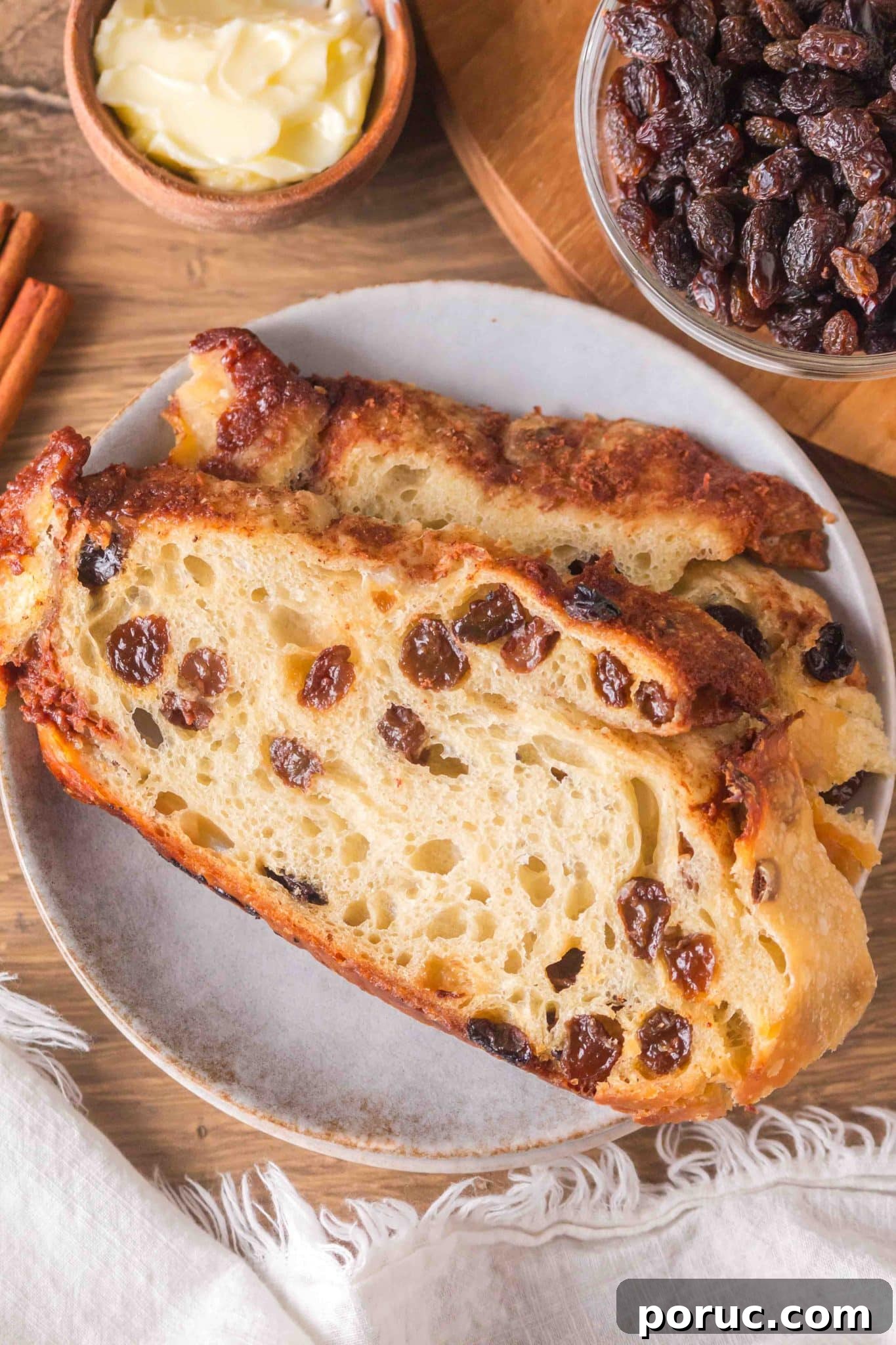 Sourdough Cinnamon Raisin Loaf — Soft, Sweet, Perfect Spice 18 Thick slices of sourdough cinnamon raisin bread on a plate. Hostess At Heart