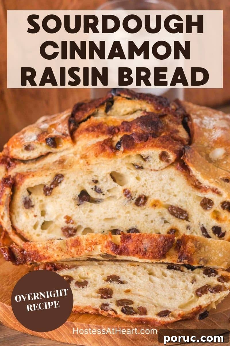 Sourdough Cinnamon Raisin Loaf — Soft, Sweet, Perfect Spice 20 An image for Pinterest of a golden brown sourdough cinnamon raisin bread with visible raisins and cinnamon swirls, cooling on a cutting board. Hostess At Heart