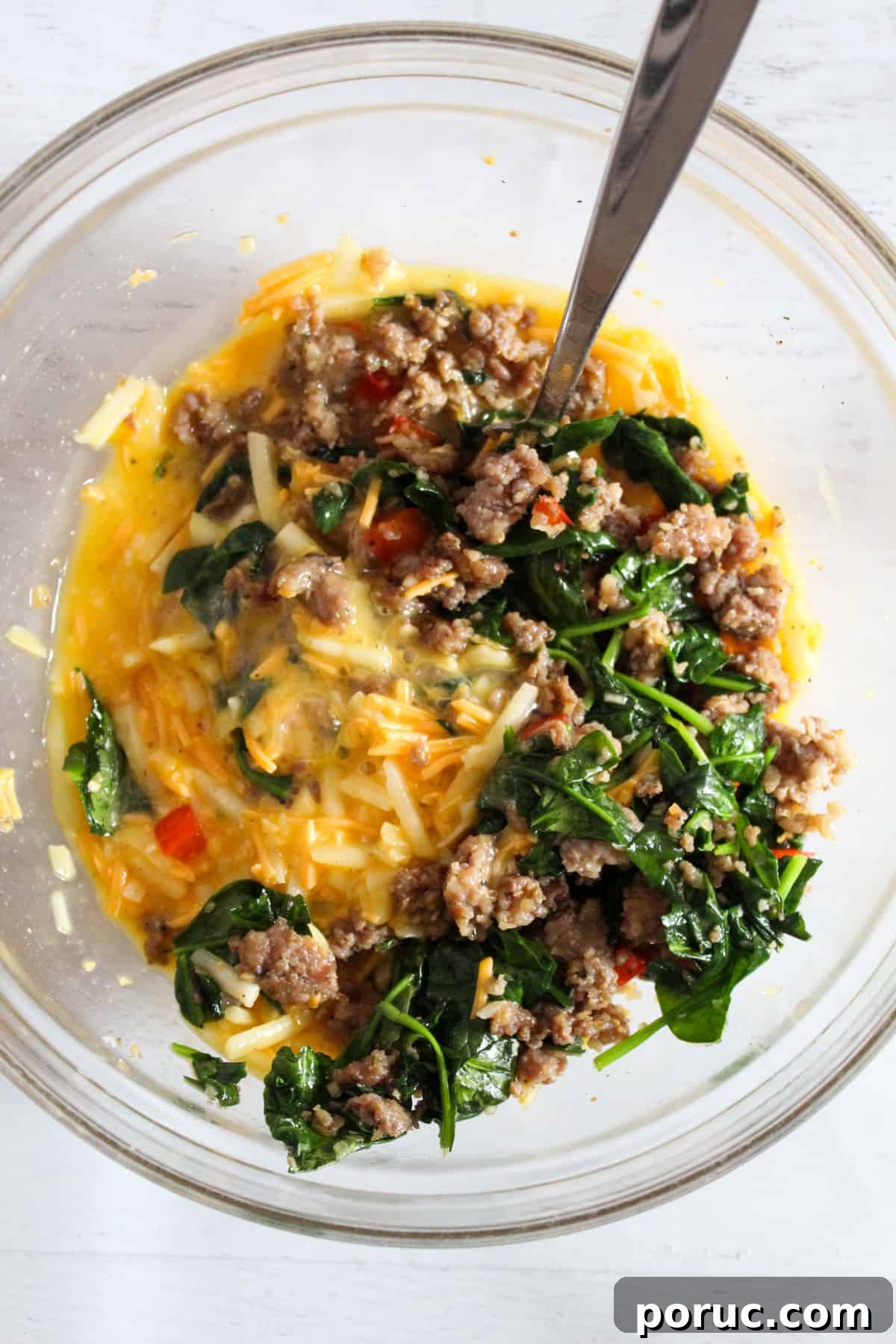 Meatless Gluten-Free Sausage Casserole Recipe for Busy Nights 9 mixing in sausage in egg mixture.