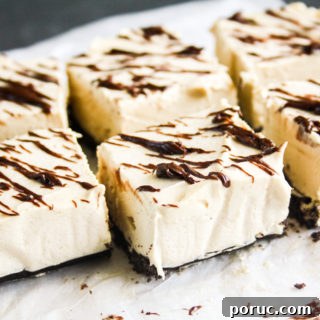 Light and creamy no bake peanut butter cheesecake bars with Oreo Crust