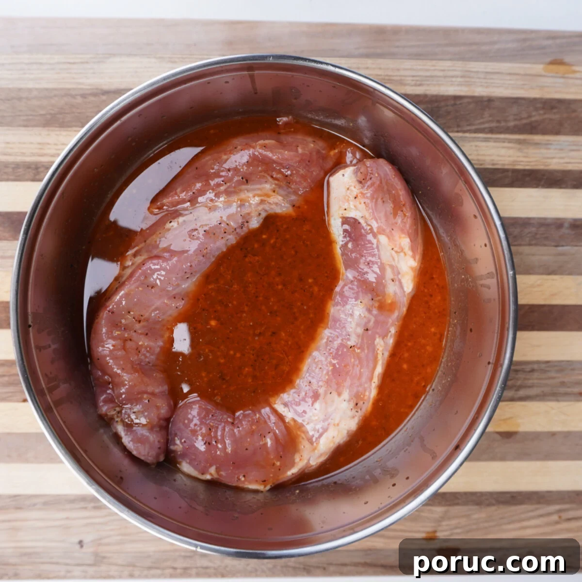 Sweet and Savory Pork Tenderloin Recipe with Glaze and Herbs 4 Marinated pork tenderloin.
